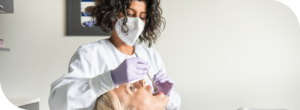 Dentist checking patient's teeth